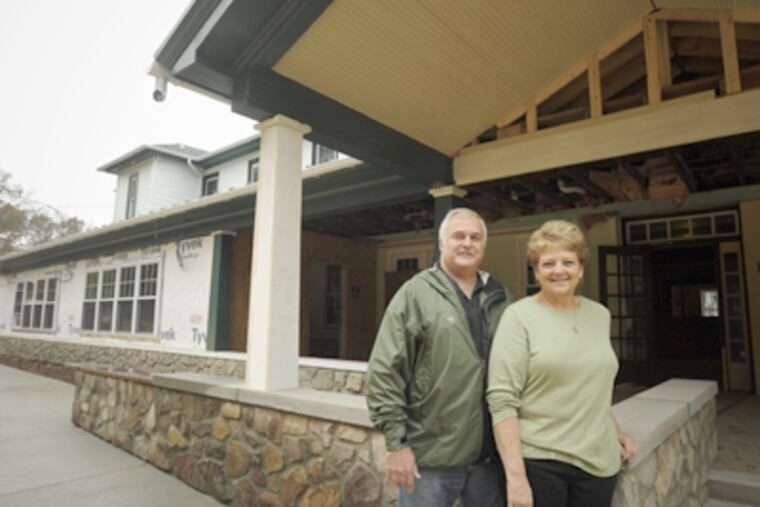 Rick and Gayle Buckman outside their inn, which will reopen in January as the Woodside Lodge at Spring Mountain. (Ron Tarver / Staff Photographer)