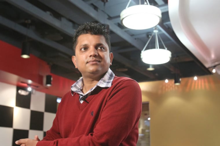 Jiger Patel in his second Checkers fast-food restaurant, at 52d and Market Streets. (Charles Fox / Staff Photographer)