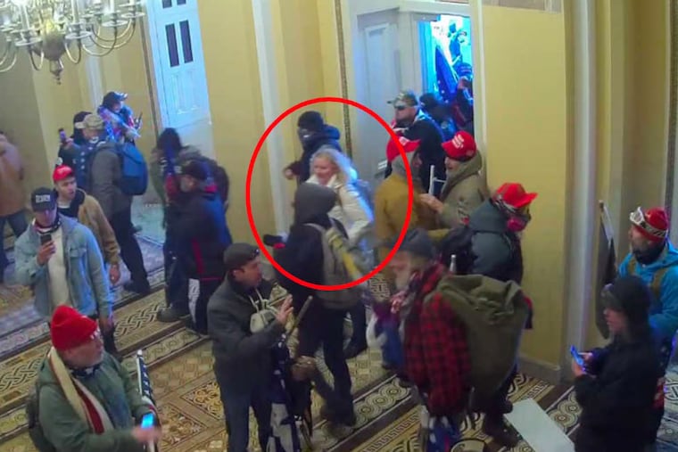A woman FBI agents have identified as Kelly McFadden O'Brien is seen entering the Capitol building in this still from Jan. 6 security footage included in court filings.