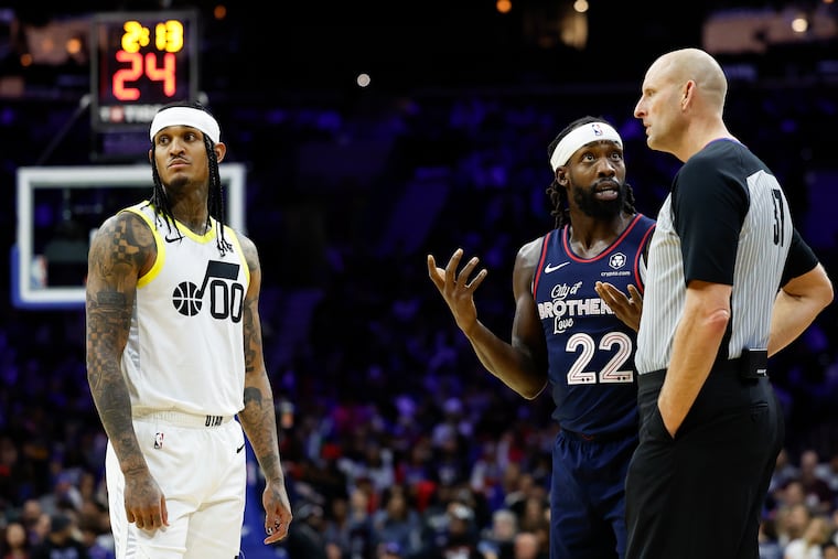 Sixers guard Patrick Beverley talks to game official Eric Dalen as Utah Jazz guard Jordan Clarkson looks away on Jan. 6.