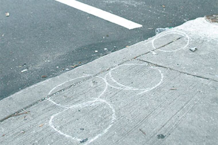 A 6-year-old boy and a 25-year-old man, the intended target, were shot at this intersection, 13th and Pike, in North Philadelphia. (Jonathan Yu / Staff Photographer)