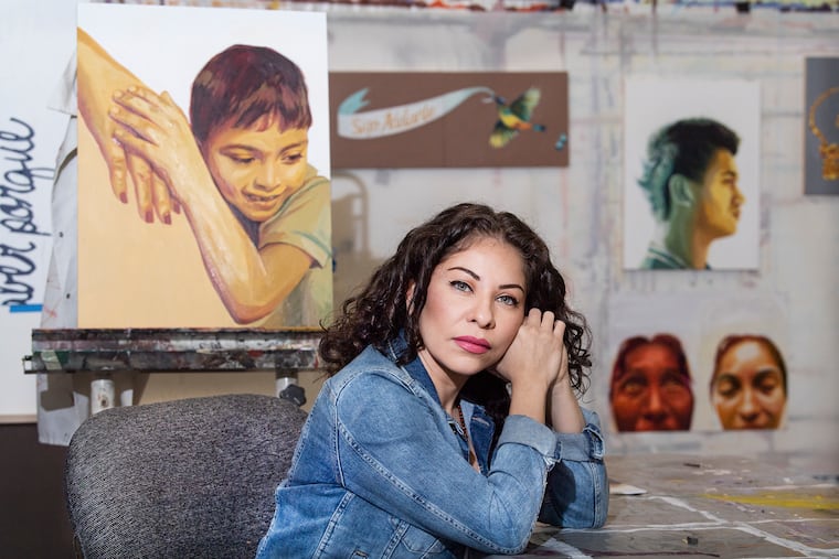 Artist Michelle Angela Ortiz in her South Philadelphia studio this month. She spoke to mothers held at the Berks detention center about their lives, hopes and dreams, including one mother and son who were deported to El Salvador.