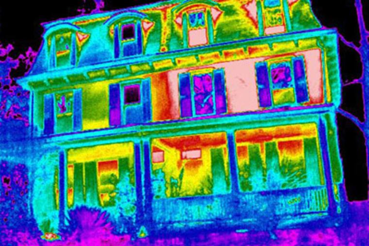 This is a thermal-imaging shot of a Chestnut Hill twin indicating that the home at left is losing less heat. Mark Group, a British firm with offices now at the Navy Yard, is conducting nighttime canvasses. (Mark Group)