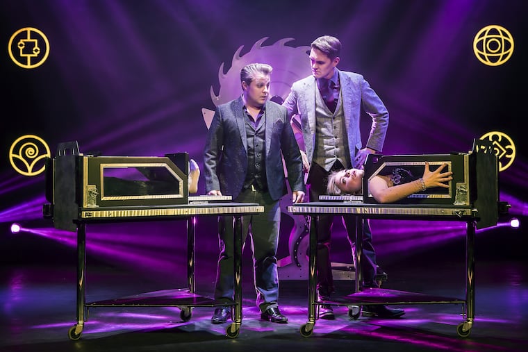Young & Strange illusionists Richard Young (left) and Sam Strange, with aerialist Rachael Kean (in box). Their act is part of the Champions of Magic show at the Merriam Theater.