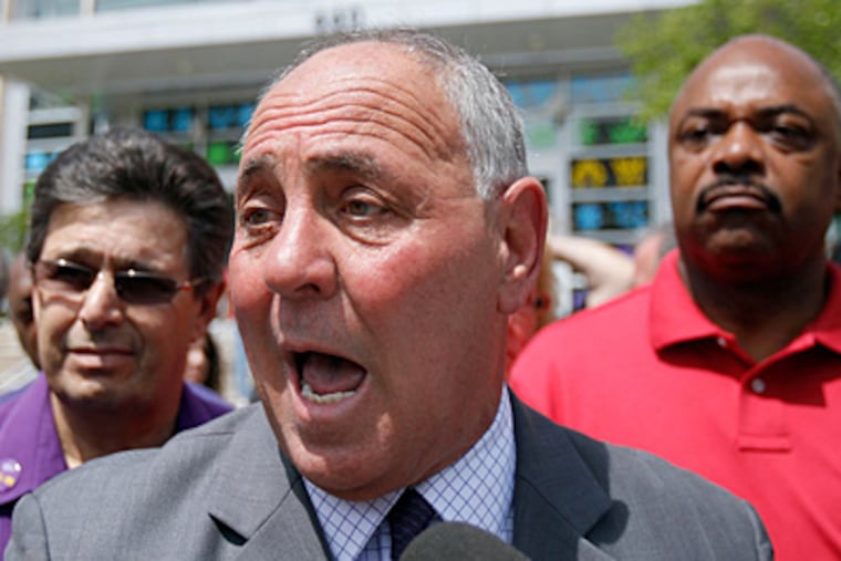 FILE: George Ricchezza, head of union local 32BJ, holds a press conference on the steps outside the Philadelphia School District's headquarters in Philadelphia on Wednesday, June 13, 2012. (DAVID MAIALETTI / Staff Photographer)