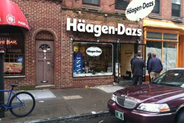 A DJ was shot and killed near his apartment above the Haagen-Dazs ice cream shop on the 200 block of South Street. (Mike Newall / Staff)