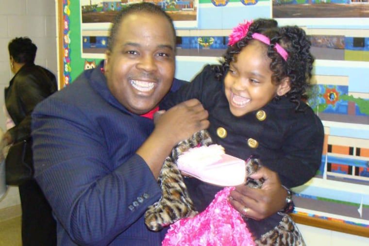 Pastor Tony Anderson and Jeniece Smith, a member of his congregation, getting in the traditional Sunday hug.