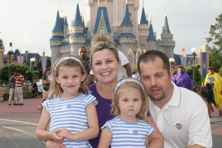 Carrie Goretzka, who was killed by a downed power line, at Disney World with daughters Chloe (left) and Carlie and husband, Michael. The utility agreed to a $105 million settlement last week.