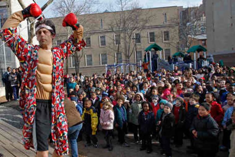 At the rally, Rocky Balboa (teacher Chris White) personifies the school's perseverance. The award marks achievement in promoting cultural awareness, world history, and global curriculum.