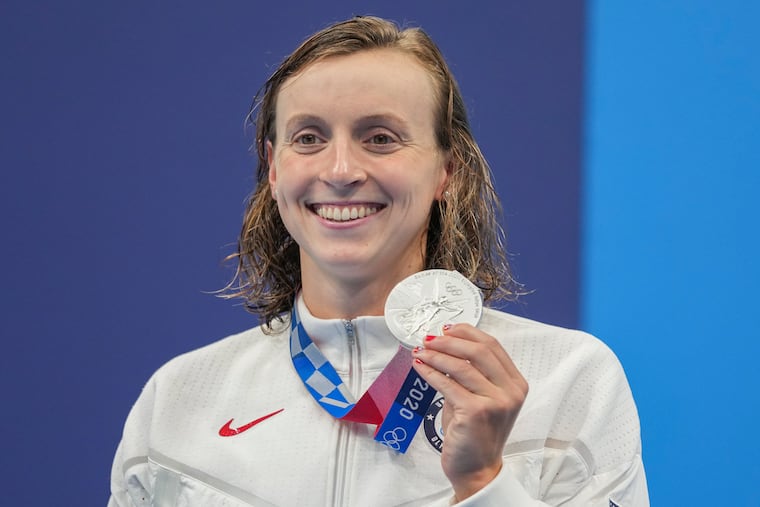 Katie Ledecky poses with her silver medal in the women's 400-meters freestyle on Monday.