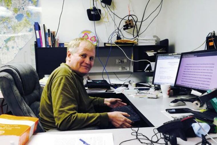 John Paff in his basement office, where he files hundreds of document requests a year.