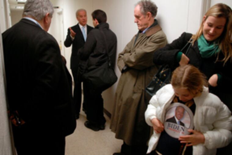 With staffers and his granddaughter, Finnegan Biden, 9, waiting for him, Sen. Joseph R. Biden Jr. talks with a caucus voterafter addressing the Polk County Democrats Central Committee in Des Moines. His crowds are growing in Iowa.
