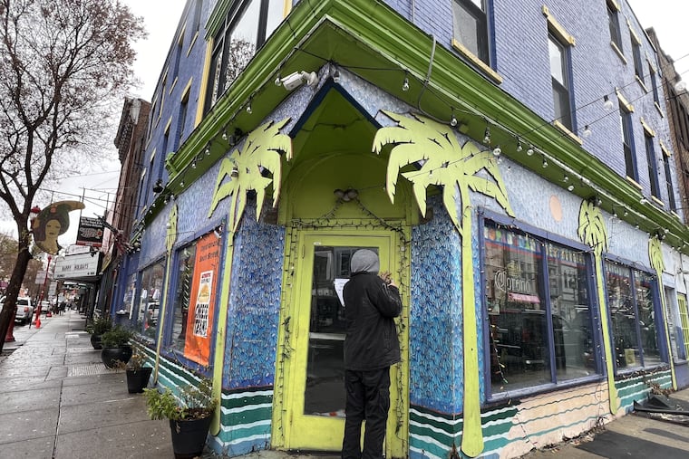 A worker installs a padlock on the front door of the former Copabanana, 344 South St., on Dec. 18, 2023.