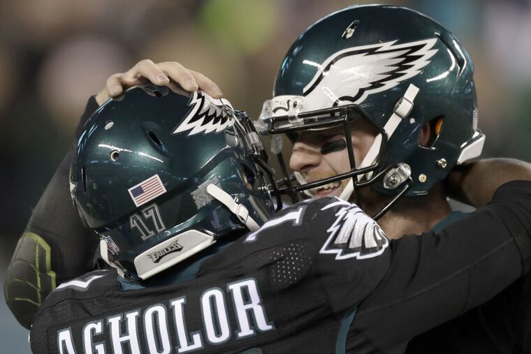Eagles wide receiver Nelson Agholor and quarterback Carson Wentz celebrate Agholor's second-quarter touchdown reception against the New York Giants on Thursday, Dec. 22, 2016 in Philadelphia.