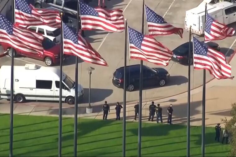 In this screen grab taken from video, authorities respond to a shooting at Lakewood Church, the Houston megachurch of celebrity pastor Joel Osteen, on Sunday.