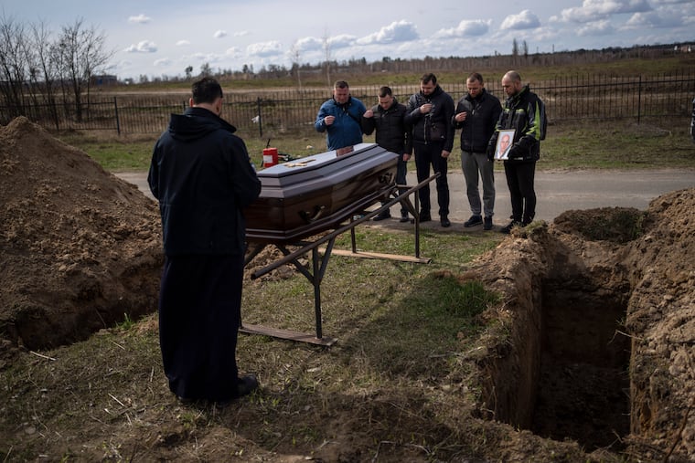 Relatives and friends attending the funeral of Andriy Matviychuk, 37, who served as territorial defense soldier, and was captured and killed by Russian army in Bucha, Ukraine.