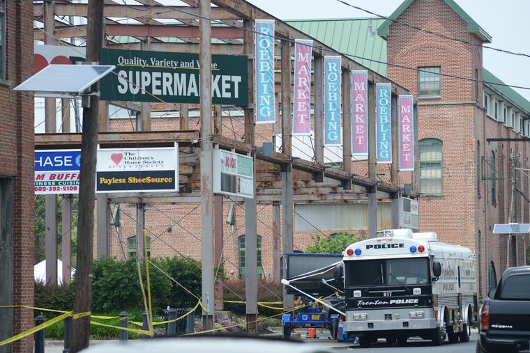 Police personnel guard the perimeter of Art All Night Trenton 2018 at the scene of a shooting that left 22 shot or injured and one man dead Monday, June 18, 2018 in Trenton, New Jersey. WILLIAM THOMAS CAIN / For The Inquirer