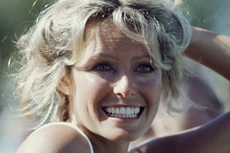 Farrah Fawcett-Majors, poses on the tennis court May 1997 in Los Angeles. (AP file photo)