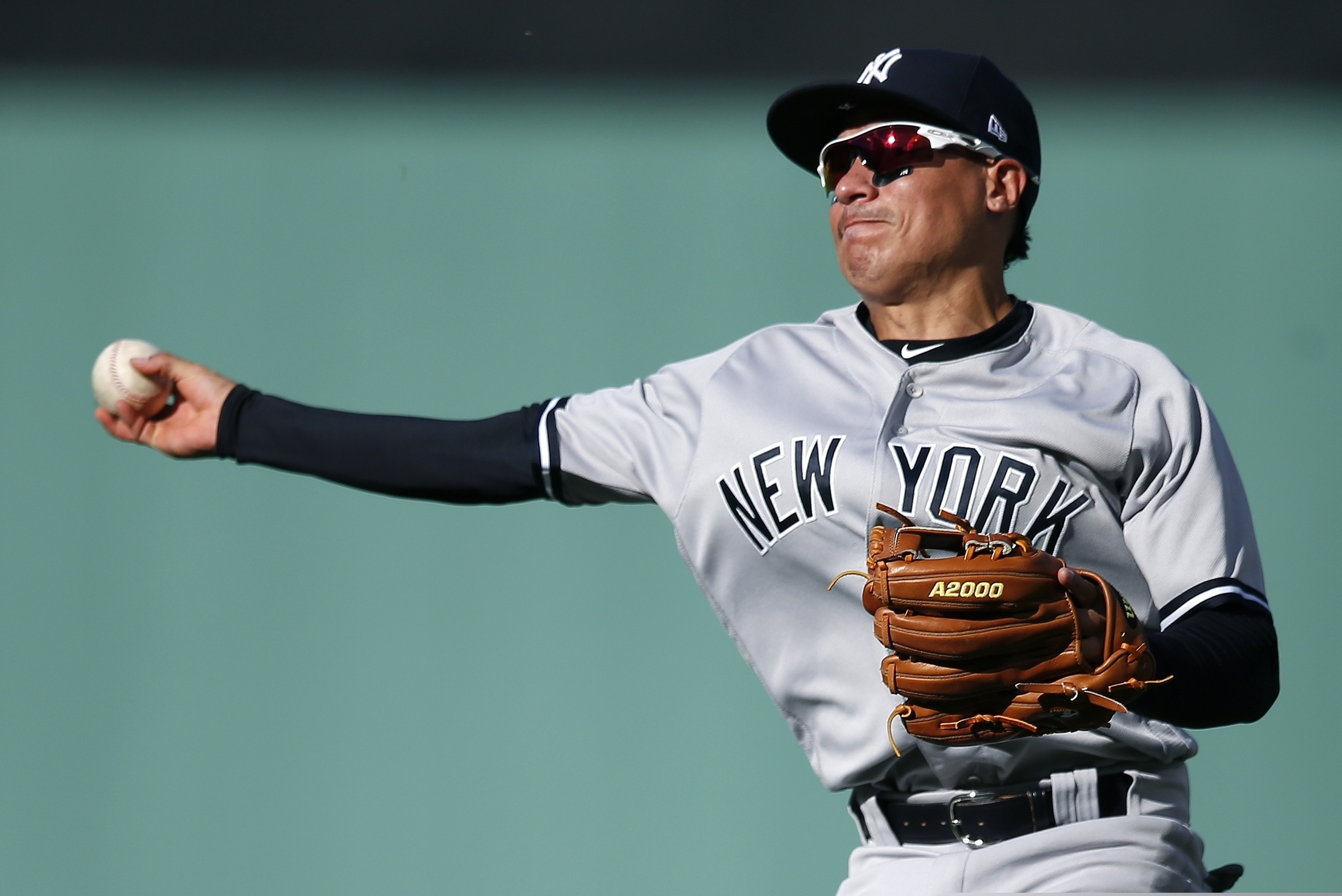 Then-Yankees infielder Ronald Torreyes throwing to first base during a 2018 game.