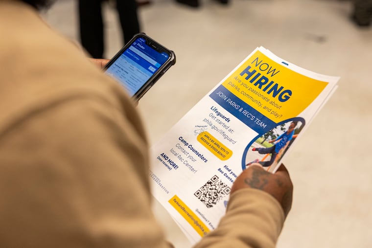 Wadie Longmore, 30, of Olney, Pa., applied to every table offering jobs and is looking at a hiring to be a lifeguard at the job fair at Mander Playground in Philadelphia, Pa., on Saturday, April 12, 2025.