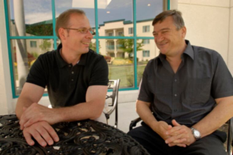 Motorika general manager Rich Mahoney (left) with founder and robot expert Omer Einav. The firm just made a deal for HealthSouth's AutoAmbulator, a robotics system for the lower body.