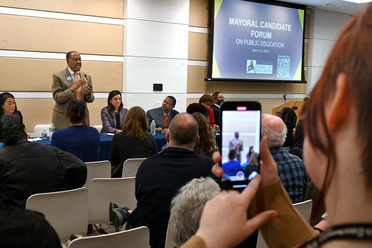 Mayoral candidate Jimmy DeLeon (standing) appeared with other candidates at a March 21 forum sponsored by the Philadelphia school board. Also pictured are Helen Gym, to DeLeon's left, Rebecca Rhynhart, and Warren Bloom Sr.