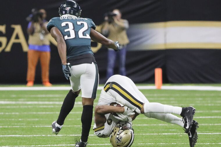 New Orleans Saints wide receiver Tre'Quan Smith catches the football pasts Eagles cornerback Rasul Douglas during the third-quarter on Sunday, November 18, 2018 in New Orleans. Douglas go hurt on the play. DAVID MAIALETTI / Staff Photographer