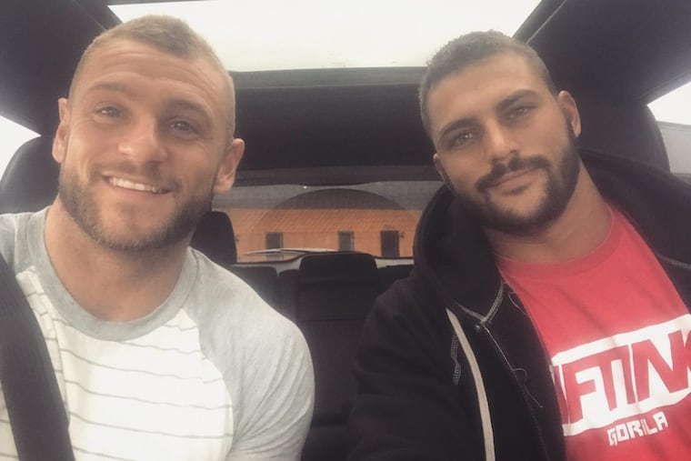 Marcous Marchese, left, says he was told to watch an anti-gay video at the Milton Hershey School. He is with his fiance Nick Mallozzi.