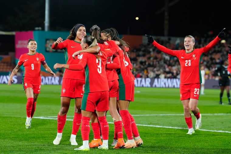 Portugal's Kika Nazareth celebrates with teammates after scoring her side's second goal against Vietnam.