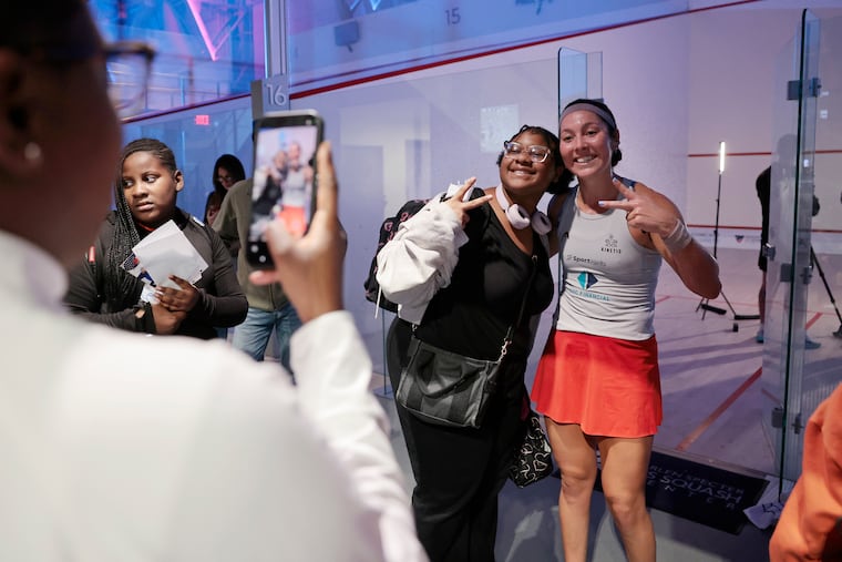 Amanda Sobhy, one of the world's top women's squash players, takes a picture with Laila Robinson, 13, during the U.S. Open Squash Championships at the Arlen Specter US Squash Center in October.