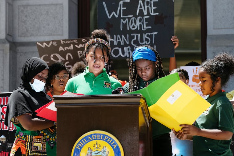 Elementary school students from Sankofa Freedom Academy Charter School speak during a rally against gun violence at City Hall in Philadelphia in 2022. Proposed closures make school choice more urgent, the authors write.
