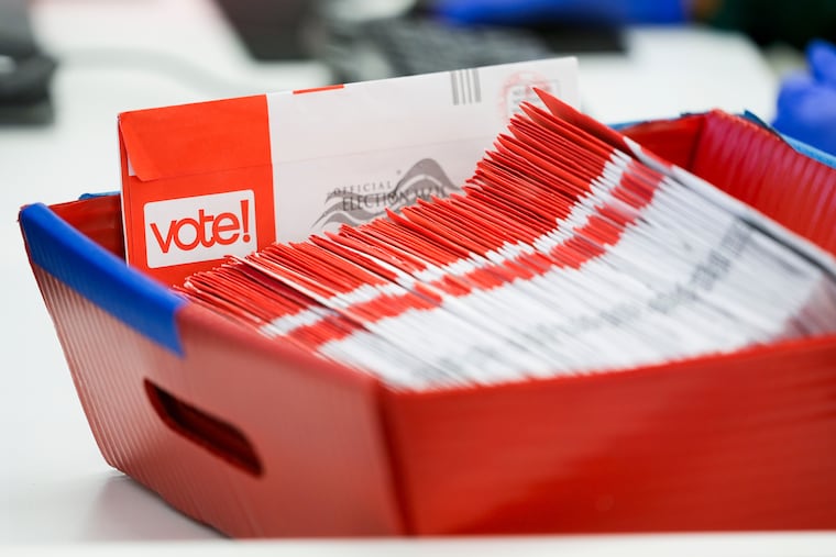 FILE - A tray of mail-in ballots is seen at King County Elections headquarters on Election Day, Nov. 5, 2024, in Renton, Wash.