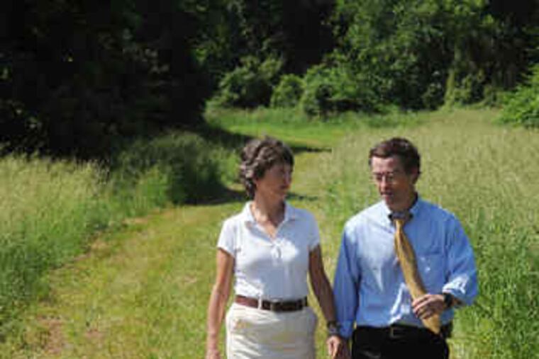 The Natural Lands Trust's Molly Morrison walks with John Quigley, state conservation secretary, in Berks County.
