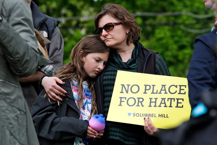 Lori Hausman, right, and daughter Josie, 9, attend a rally organized by Squirrel Hill Stands Against Gun Violence in the Squirrel Hill neighborhood of Pittsburgh on Sunday, April 28, 2019. It was six months yesterday that a gunman shot and killed 11 people while they worshipped at the Tree of Life Synagogue on Oct. 27, 2018.