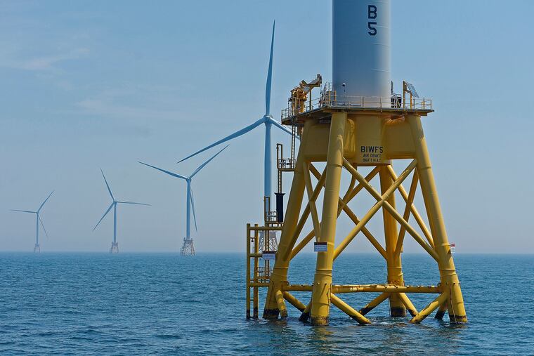 FILE- This June 12, 2017, file photo shows five turbines of the Block Island, R.I., Wind Farm. At least three firms are interested in building offshore wind energy projects off the coast of New Jersey. "Today is an important milestone in the state's desire to build out its renewable energy portfolio," said Thomas Brostrom, CEO of Orsted US Offshore Wind and president of Orsted North America. Its proposed Ocean Wind project would be built 15 miles off Atlantic City.