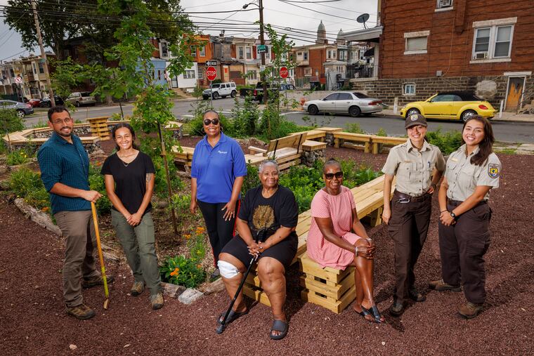 From left are Robin Irizarry, manager for the Delaware River Watershed Program, Skye Glover, Delaware River Watershed Program coordinator, and Aneca Atkinson, director Delaware River Watershed Program. Seated from left are Victoria Miles-Chambliss and Karen Small, both with Empower CDC Inc. Second from right is Carmelita Rosner and Rae Milmore with the U.S. Fish and Wildlife Service. They are at the Community Garden at Cecil and Kingsessing in Southwest Philadelphia. This is a pollinator garden funded with local and federal dollars as seen on Tuesday, July 18, 2023