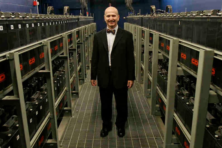 Cristobal Conde, amid banks of batteries, will be replaced by Russell Fradin, former Aon Hewitt and Bisys official.