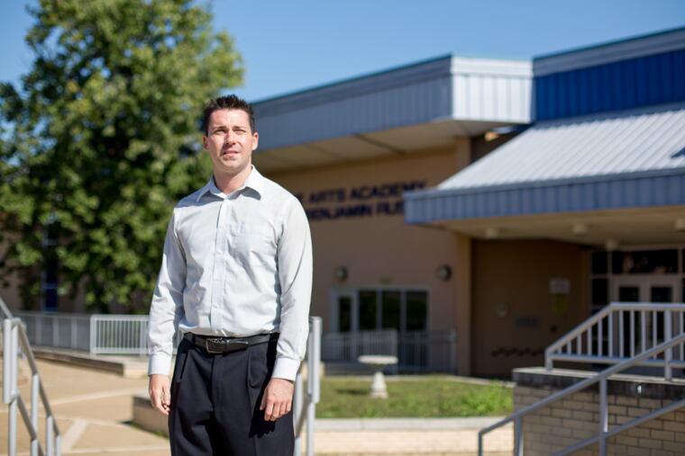 Bryan Steinberg, a social studies teacher at the Arts Academy at Benjamin Rush High School in Northeast Philadelphia, has taught in the Philadelphia School District without a contract for four years and his salary is frozen.