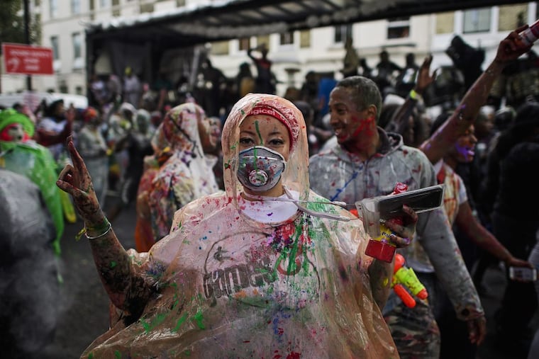 Revelers enjoy a Jouvert event in London. A similar is set for Sunday in Fairmount Park.