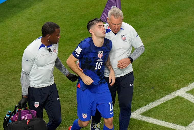 Christian Pulisic was helped off the field by U.S. team medical staff after scoring in the Americans' 1-0 win over Iran at the World Cup.