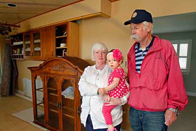 From Left: Laurel Haeser who is holding grand daughter, Eden Laut,18 mo. and LaurelÕs husband Bill Haeser are standing at a unfinished kitchen of their house 7 Cummings Place at Brigantine, NJ.
May 23, 2013. ( AKIRA SUWA / Staff Photographer )