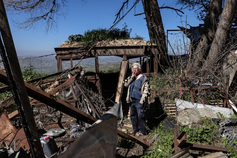 Orna Weinberg, 60, surveys the damage to a military outpost in northern Israel.