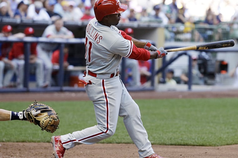 Jimmy Rollins hits a two-run single during the eighth inning against the Brewers on Thursday, July 10, 2014, in Milwaukee. (Morry Gash/AP)