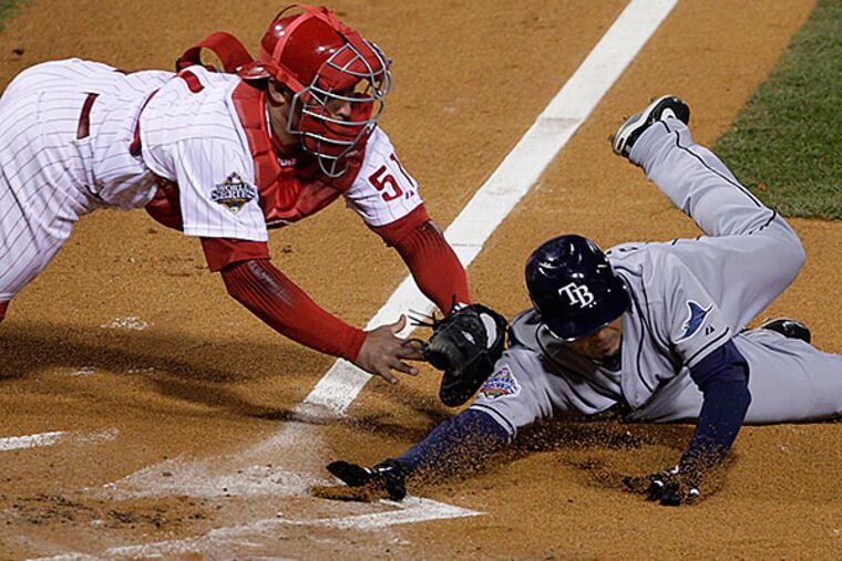 Phillies' catcher Carlos Ruiz, left, tags out Jason Bartlett in the 7th inning of Game Five of the World Series between the Phillies and the Tampa Bay Rays at Citizens Bank Park in Philadelphia, Pa., October 29, 2008.