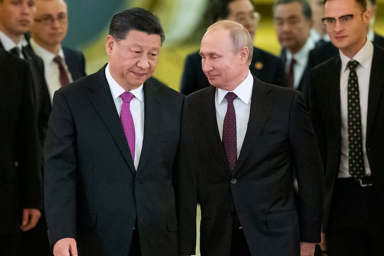 Chinese President Xi Jinping, center left, and Russian President Vladimir Putin, center right, entering a hall for talks in the Kremlin in Moscow in June 2019.