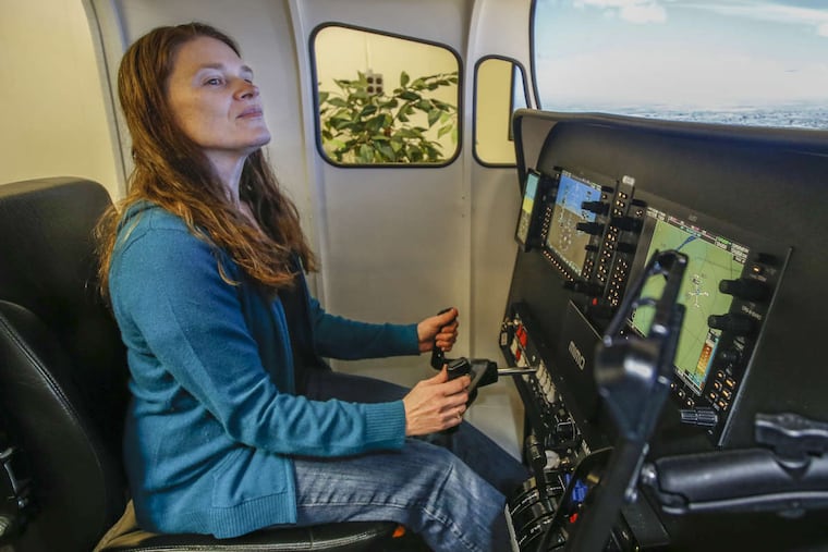 Cindy Treyger spends time in the Elite flight simulation at the Infinity Flight Group flight school. She will have to spend around 20 hours on the simulator as part of her training. The Veterans Administration is covering tuition for her to attend Infinity Group flight school. MICHAEL BRYANT / Staff Photographer