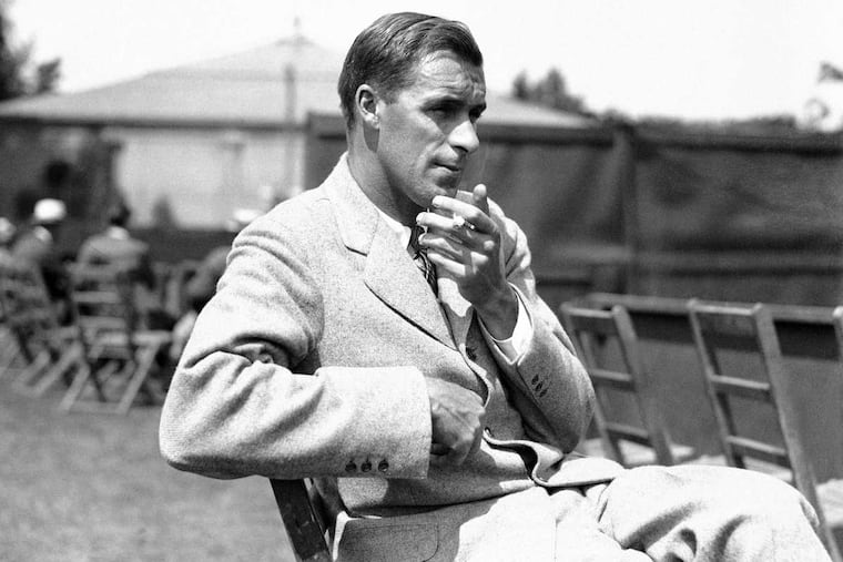 In this June 1925 photo, Bill Tilden watches a match in Philadelphia, during the National Doubles Tennis matches. A group is pushing for a historical marker touting the accomplishments of tennis great Bill Tilden at Philadelphia's Germantown Cricket Club, but hit a roadblock over questions about the star's conduct with teenage boys.