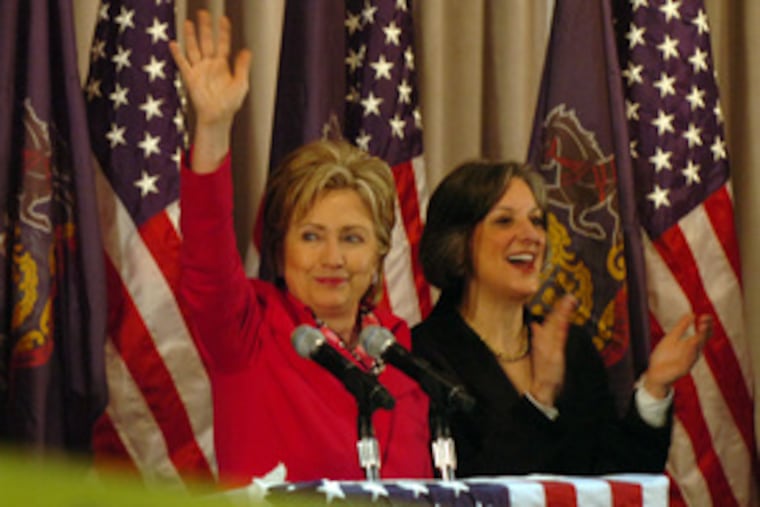 Hillary Rodham Clinton waves after speaking to Philadelphia Democrats. She also addressed a manufacturing forum in Pittsburgh and a gathering at Bristol Junior Senior High School.