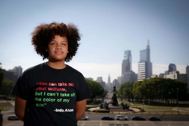 India Alston, the 13-year-old daughter of Charlie Mack Alston, poses for a portrait with a T-shirt she created in Philadelphia, Pa. on July 13, 2020.