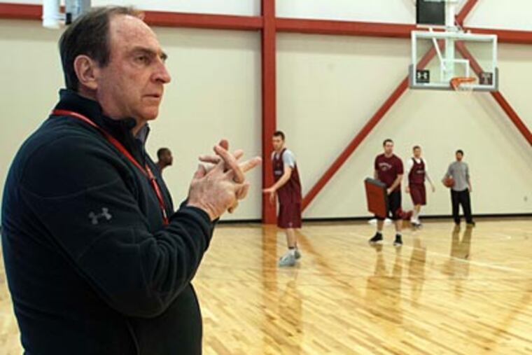 Temple head coach watches his team practice at the Pearson-McGonigle practice facility. (David M Warren/Staff Photographer)